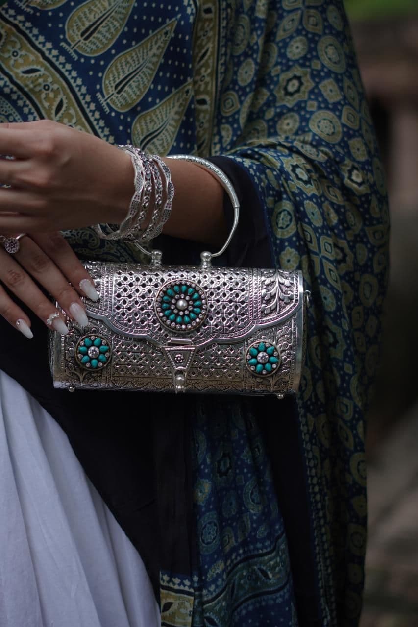 Carved silver clutch with turquoise flowers