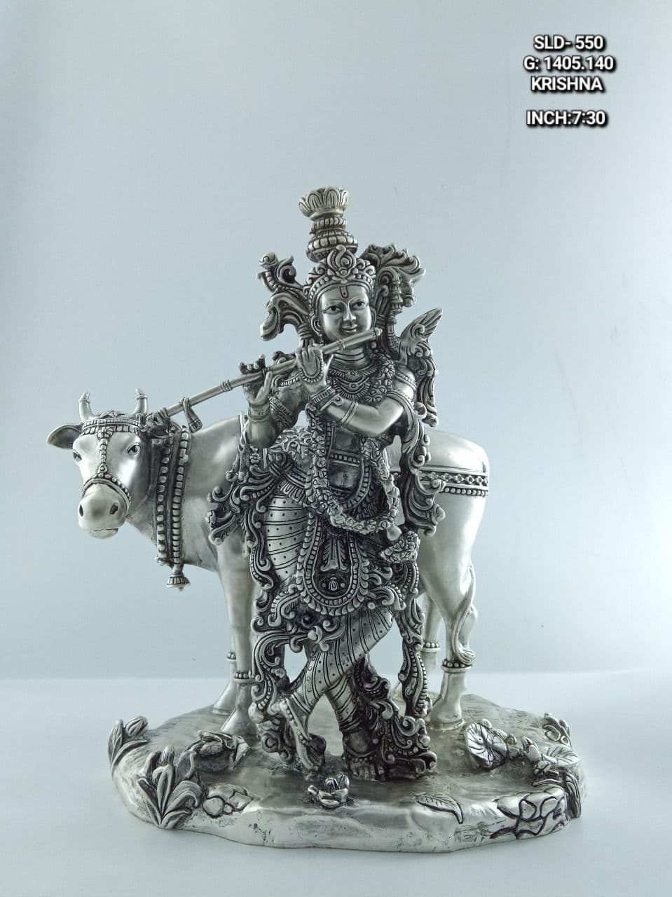 Antique silver Krishna with a cow