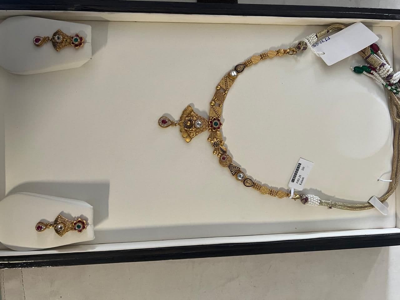 Kalash gold necklace set in its box